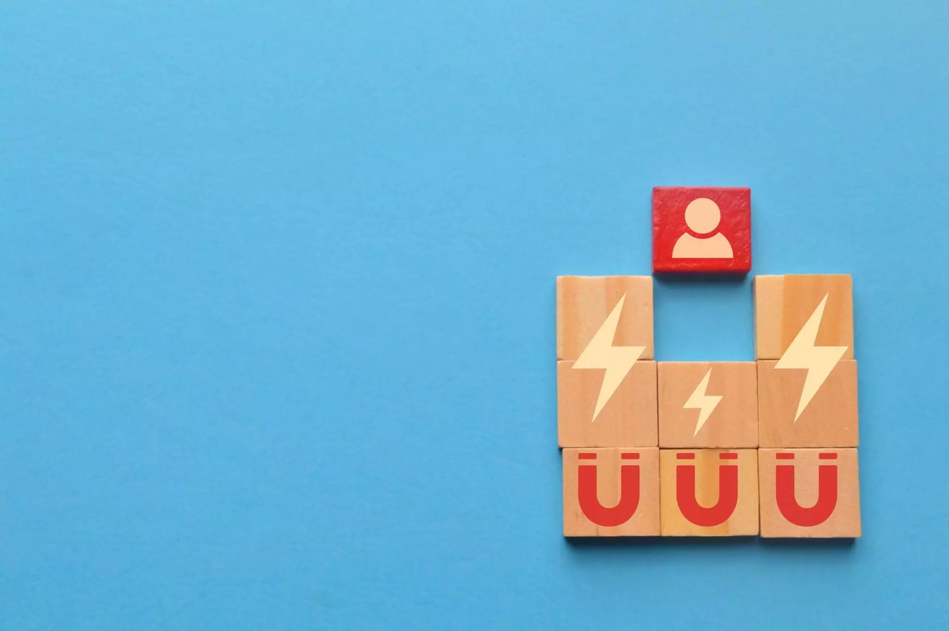 Wooden blocks with magnet icons pull a person in a row blocks. Recruiting and search talent workers
